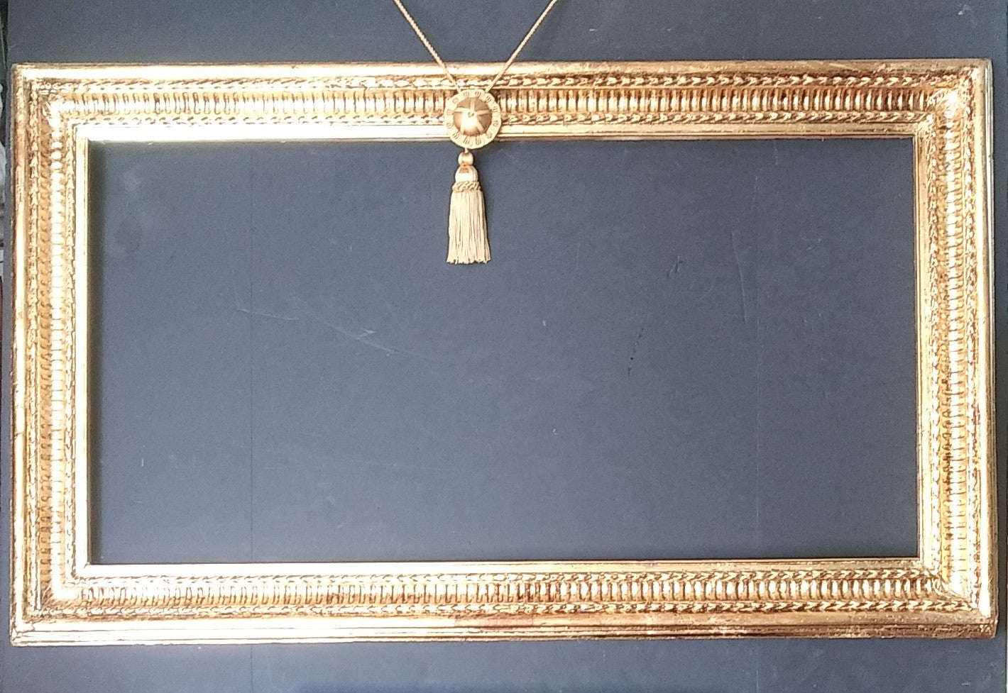 20' x 39" 19th Century Gilded Fluted Cove Frame with Carved Bell Flower Ornament