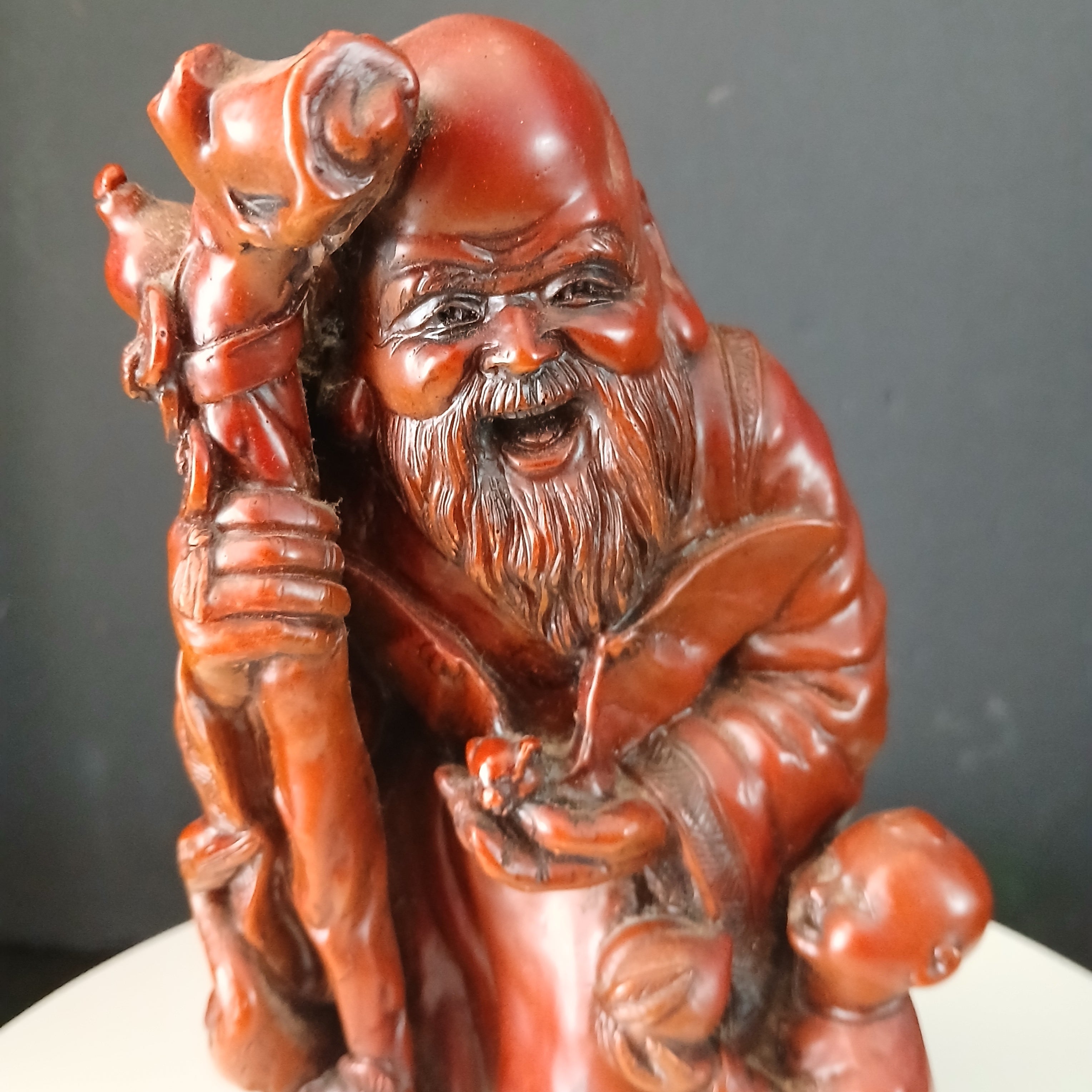 Vintage Chinese Red Resin Figure of an Immortal with a Child and a Wading Bird