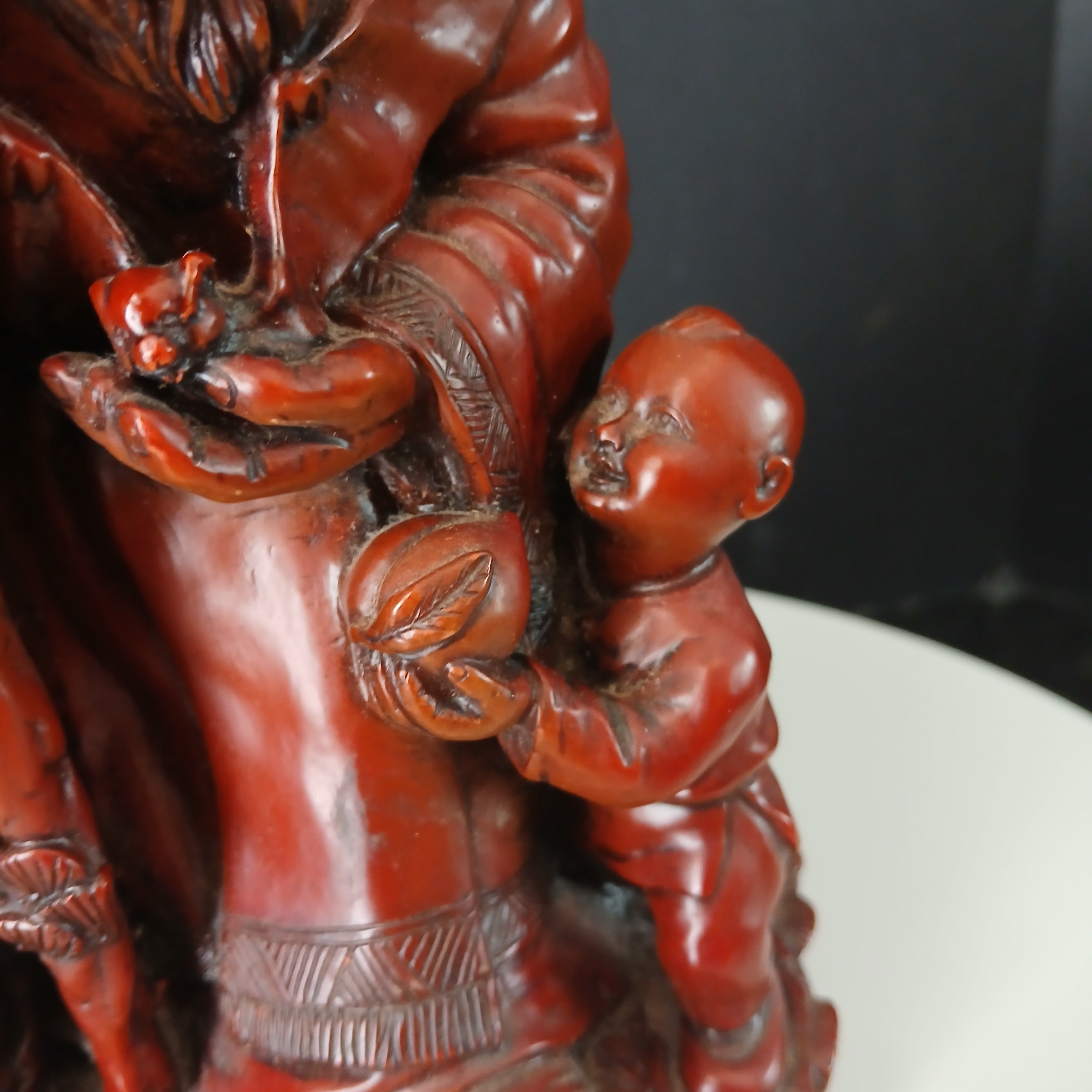 Vintage Chinese Red Resin Figure of an Immortal with a Child and a Wading Bird